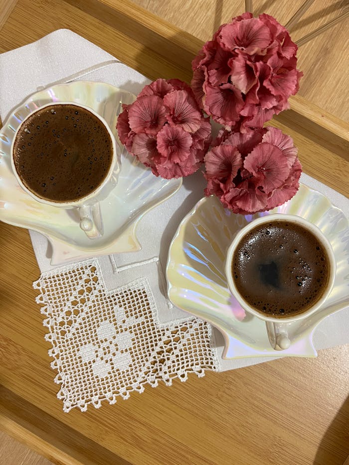 services-02 Stylish coffee setup with floral accents on a wooden tray.