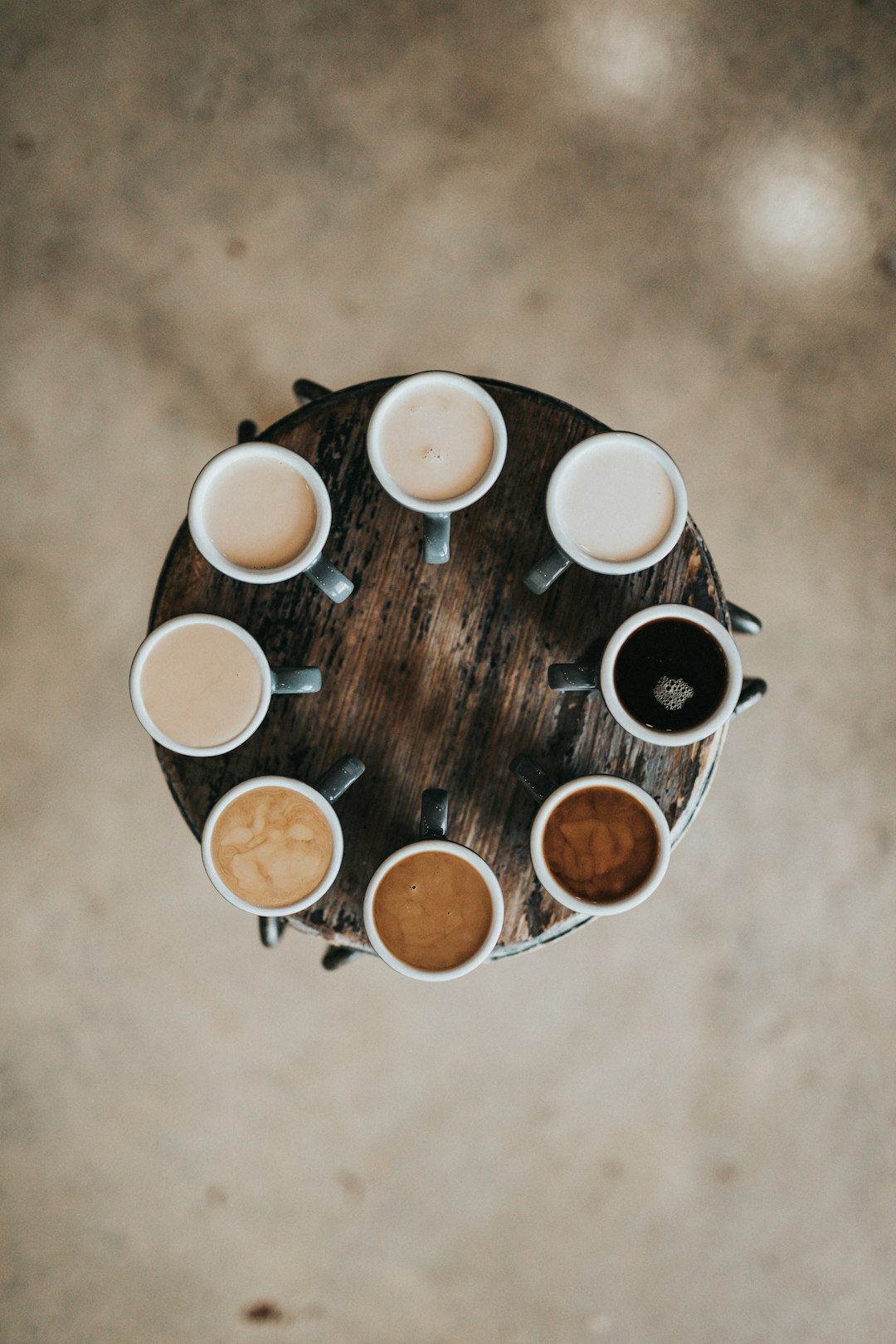 hero-img-01 flat-lay-photography-of-eight-coffee-latte-in-mugs-on-round-table-pmw4jzelqcw